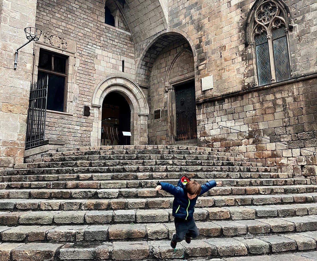 Children exploring Barcelona's Gothic Quarter on a family tour
